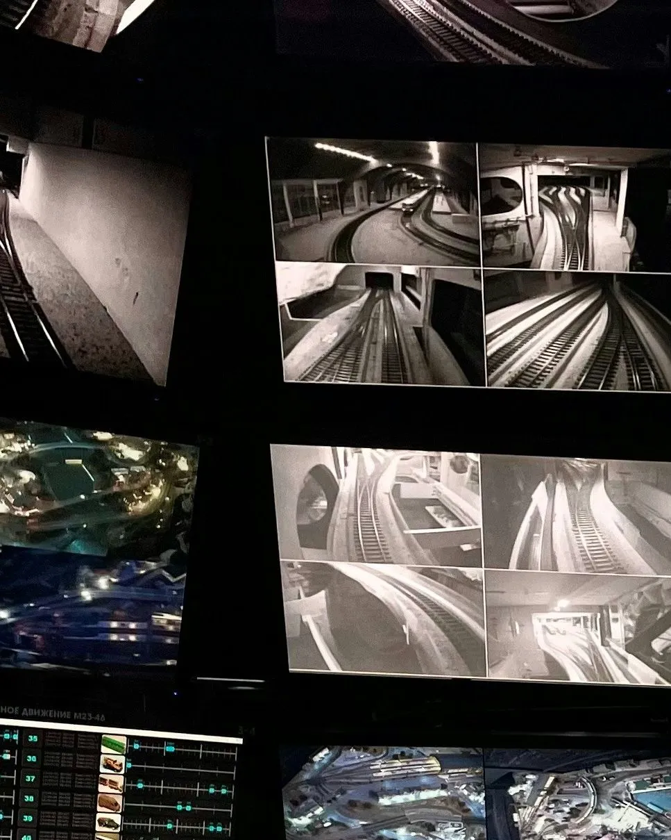 A wall of monitoring screens in a control room