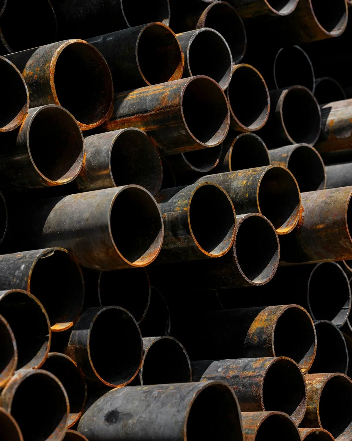 Stacked steel pipes seen end-on
