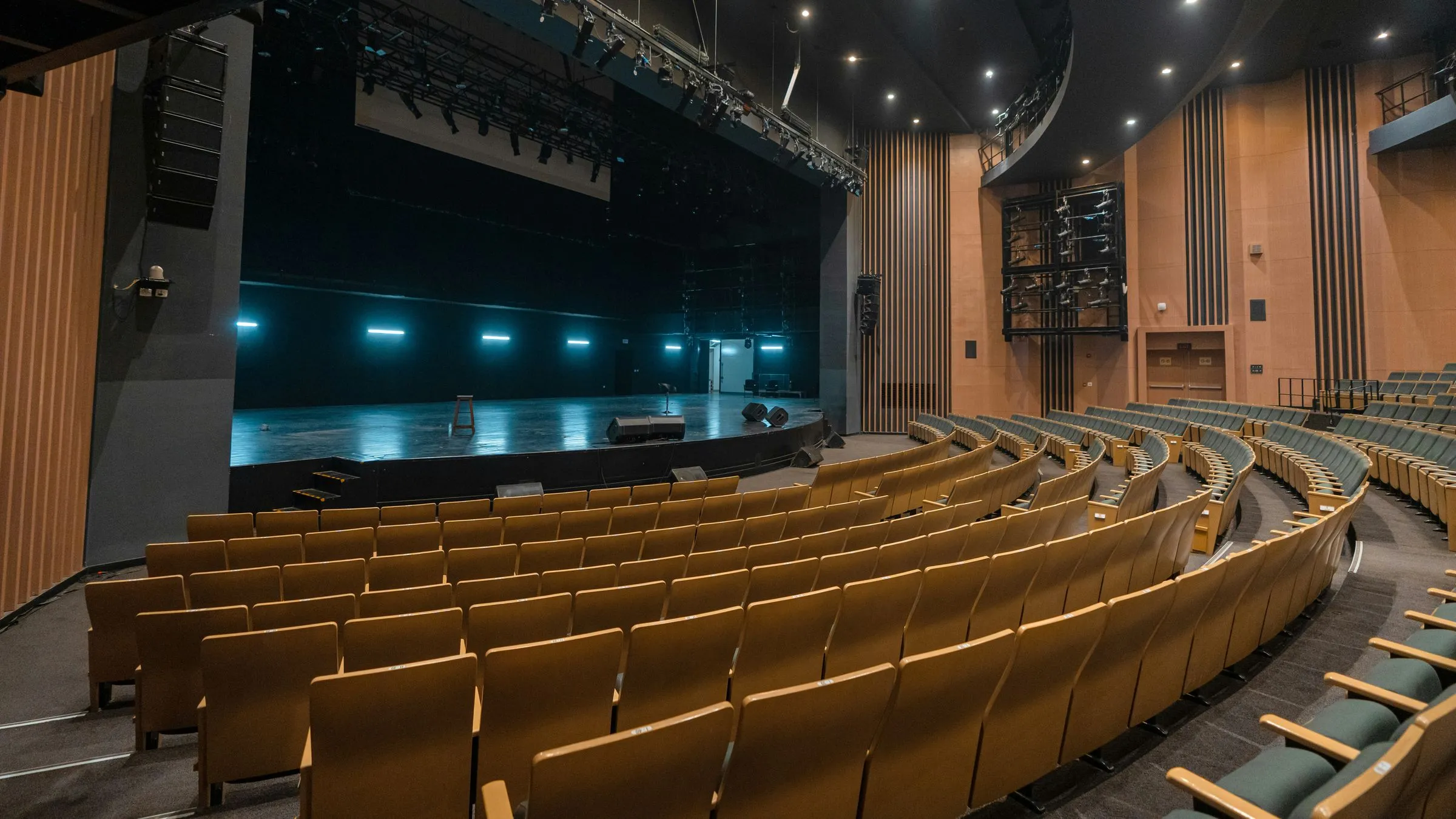 An empty theatre with a lit stage
